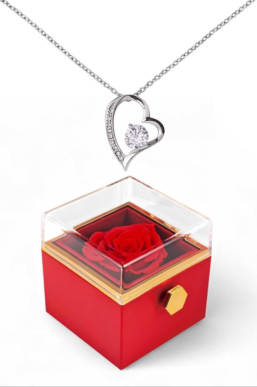 Heart-shaped silver necklace with a red rose in a transparent box on a white background